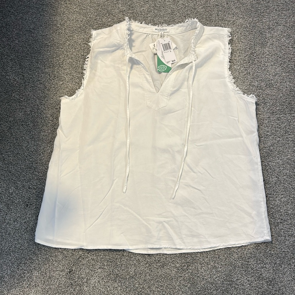 Brand new with tags! White blouse with frayed detail around neck and sleeves.